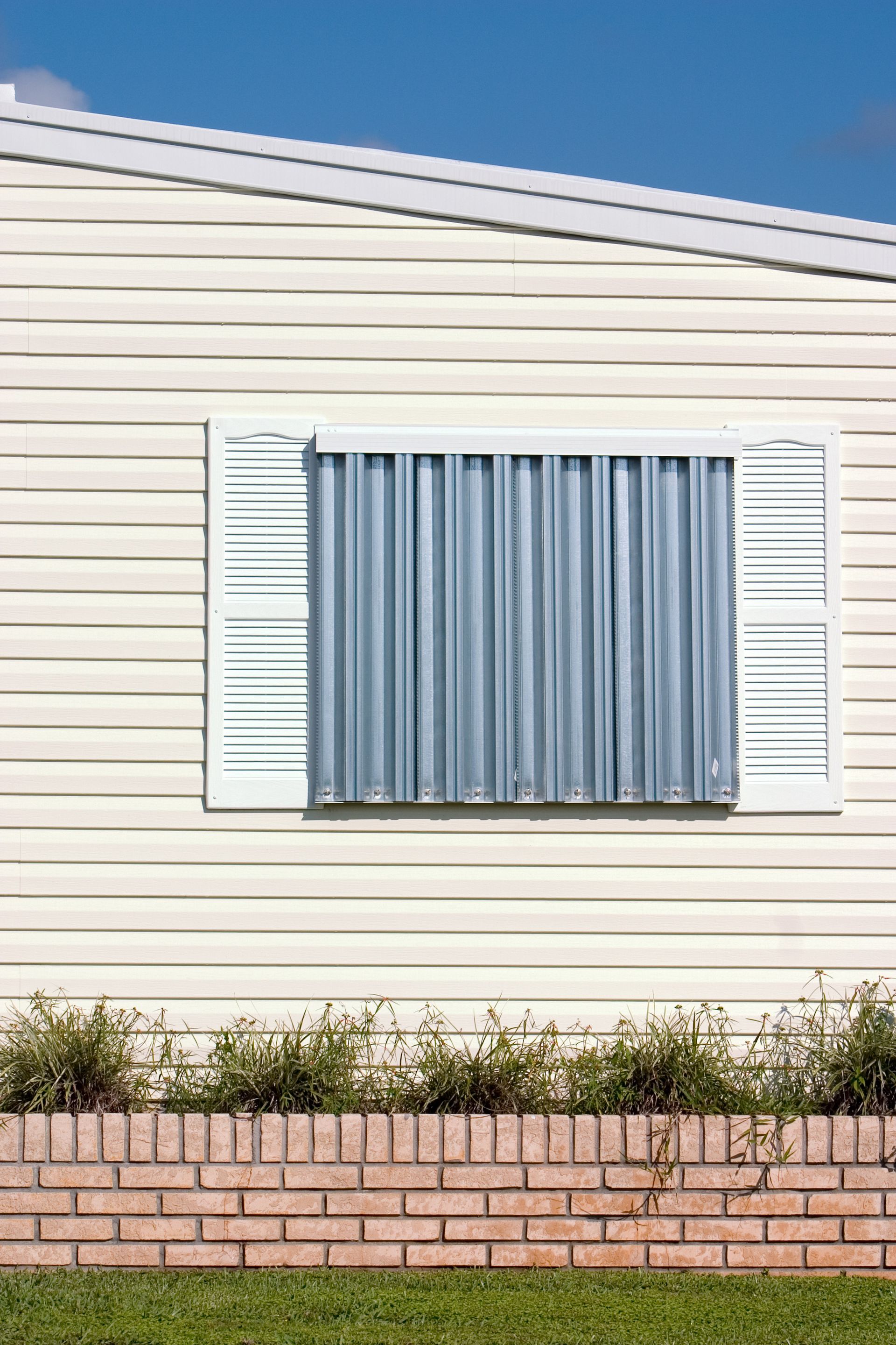 Hurricane protection panels on windows